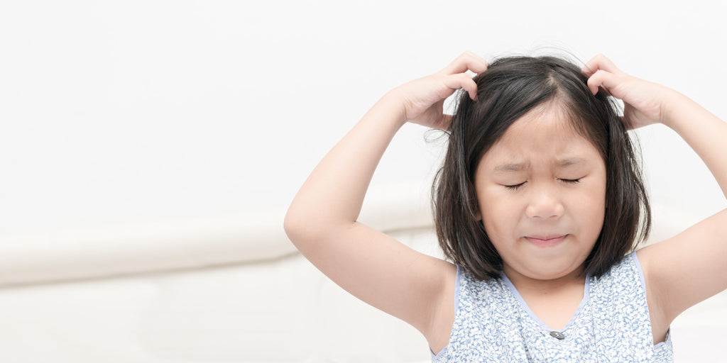 How to Tell if Your Kid’s Flaky Scalp Is Dandruff or Psoriasis, According to Dermatologists